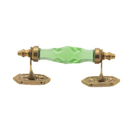 Vintage green faceted crystal and brass pull handle with a 5-inch center on a classic wooden cabinet