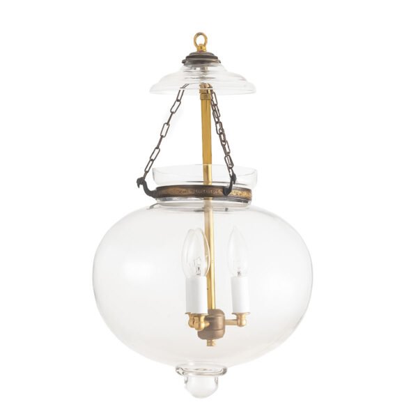Large plain clear glass onion lantern chandelier with antique brass finish hanging in an entryway