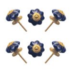 Deep blue ceramic multi-lobed knobs with antique brass accents in a set of 6