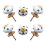 Blue polka dot ceramic knobs with gold starburst accents, set of 6